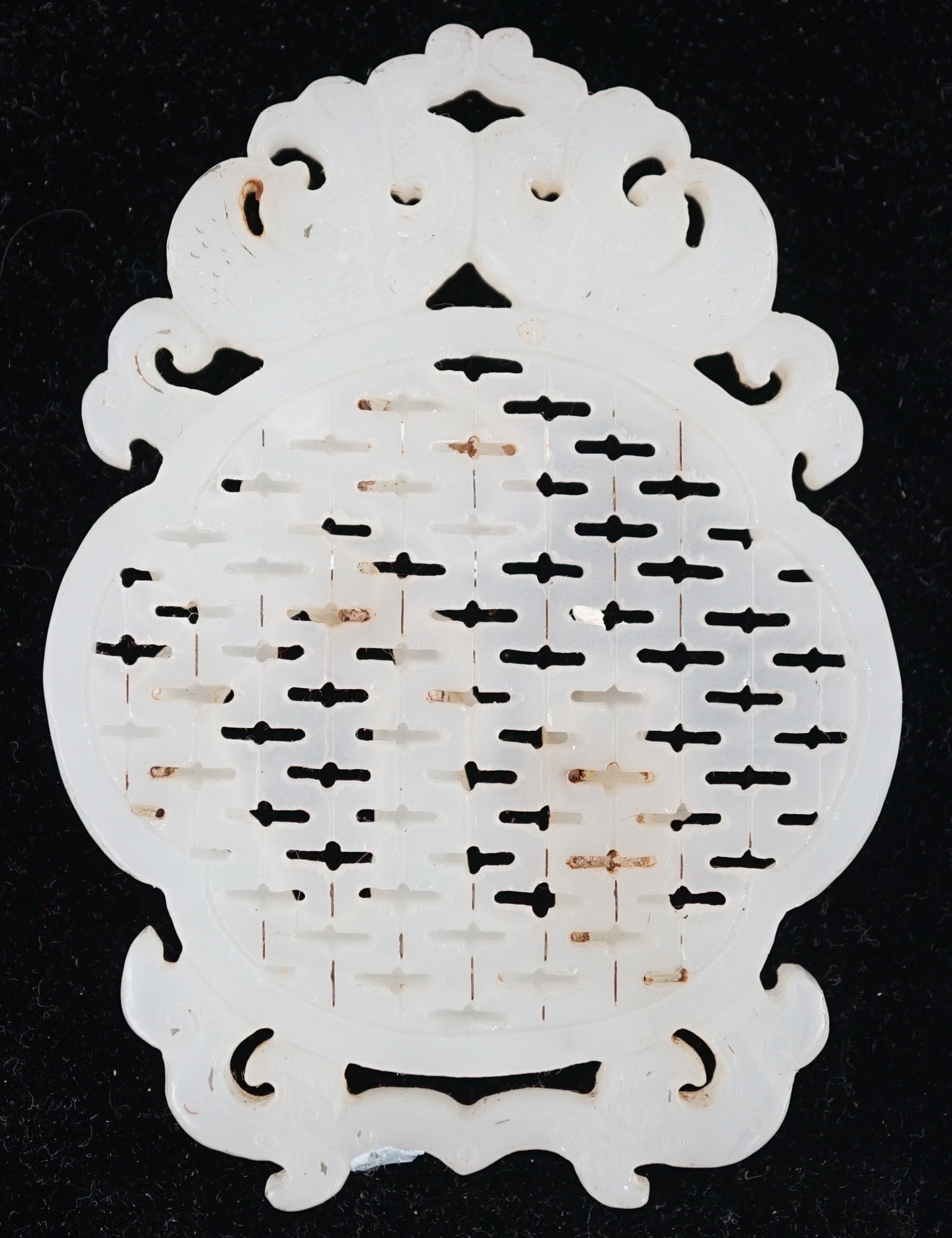 A Chinese white jade reticulated plaque, 19th century, 10.2cm high